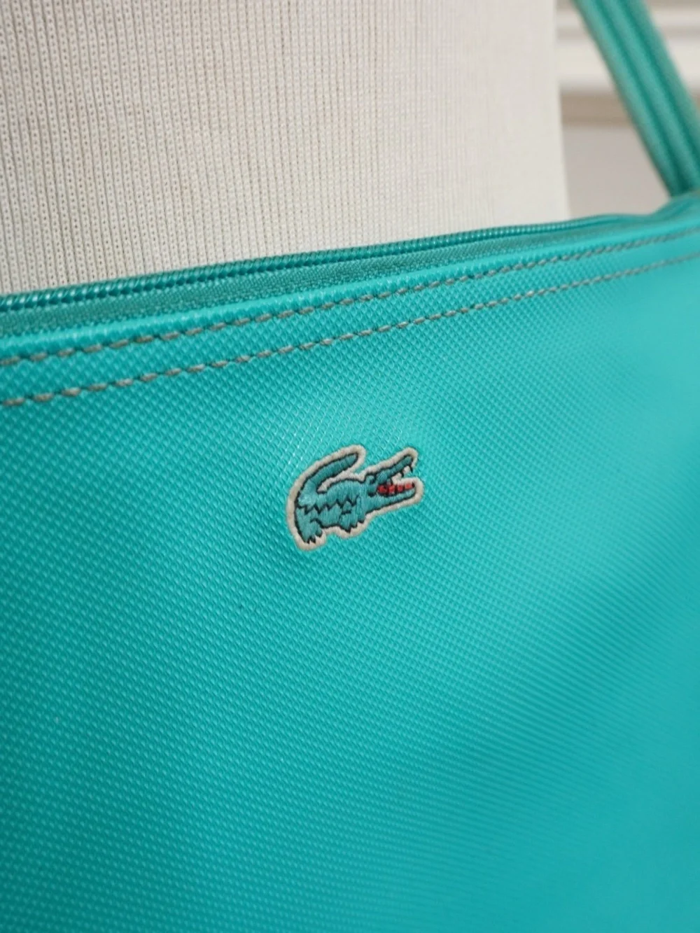 Lacoste Teal crossover bag PVC w/leather trimming